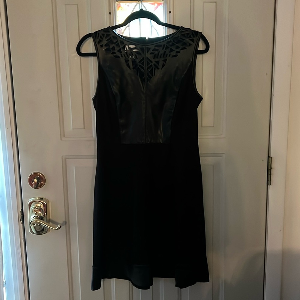 Women’s black faux leather laser cut black dress/polyester spandex dress size 8
